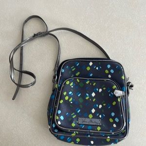 Vera Bradley leather bag.  9x8 size.  Inside zipper and pocket.